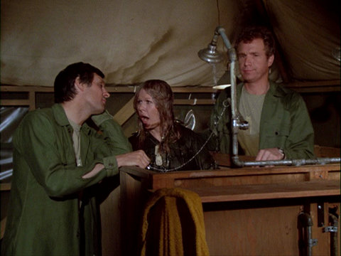 Still from the M*A*S*H episode Hot Lips and Empty Arms showing Hawkeye, Margaret, and Trapper.