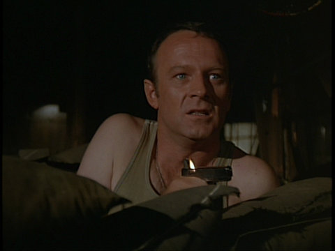 Still from the M*A*S*H episode Of Moose and Men showing Frank with his lighter.