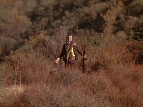 Image of Klinger standing on a hill looking out over the 4077th
