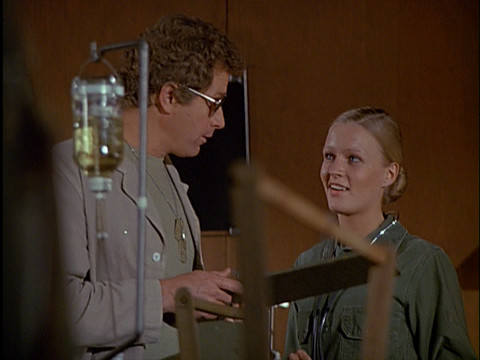 Trapper and his sunglasses talk to a nurse