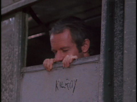 B.J. peeking out a bus window