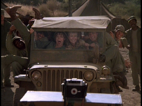 Members of the 4077th crammed into a jeep