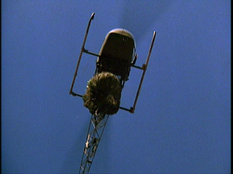 A helicopter dropping a load of garbage