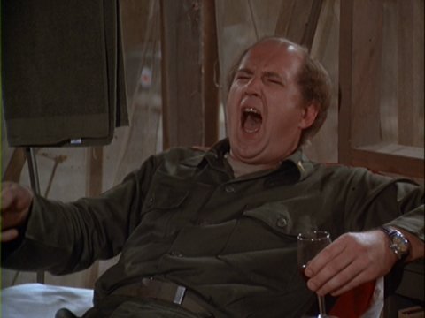 Charles seated in the Swamp, drink in hand