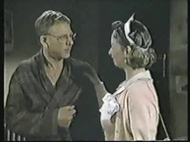 Still from the AfterMASH episode Fever Pitch showing Father Mulcahy and Sarah.