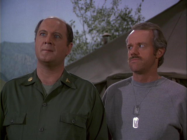 Still from the MASH episode Heroes showing Charles and BJ