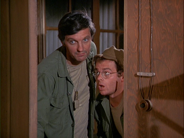 Still from the MASH episode A Full Rich Day showing Hawkeye and Radar.
