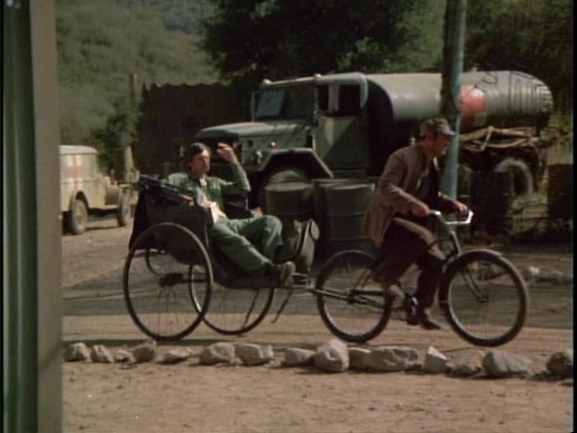 Still from the MASH episode Welcome to Korea showing Hawkeye.