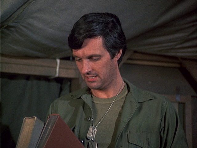 Still from the MASH episode Love Story showing Hawkeye.
