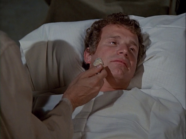 Still from the MASH episode Carry On Hawkeye showing Trapper.