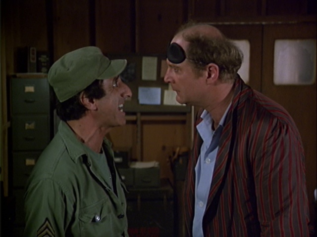 Still from the MASH episode Bottle Fatigue showing Klinger and Charles.