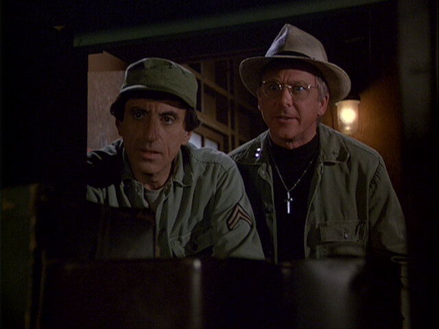 Still from the MASH episode Blood Brothers showing Klinger and Father Mulcahy.