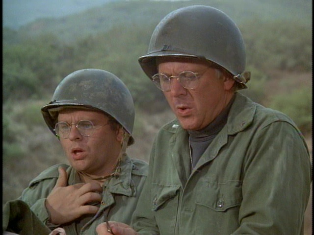 Still from the M*A*S*H episode Mulcahy's War showing Radar and Father Mulcahy.