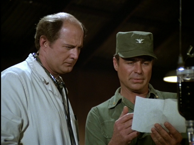 Still from the MASH episode Rally Round the Flagg, Boys showing Charles and Colonel Flagg.