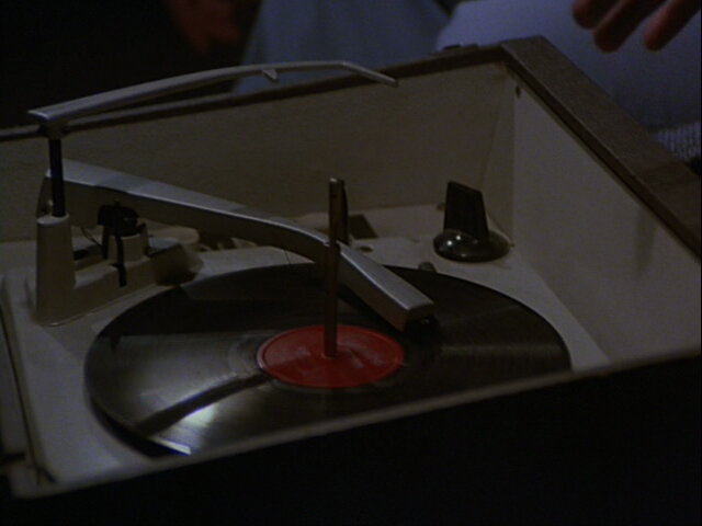 Still from the M*A*S*H episode Heal Thyself showing Charles listening to music.