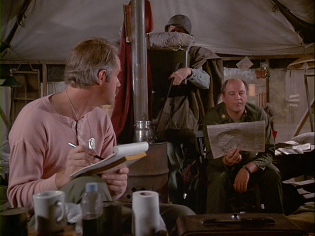 Still from the M*A*S*H episode Picture This showing Charles listening to music.