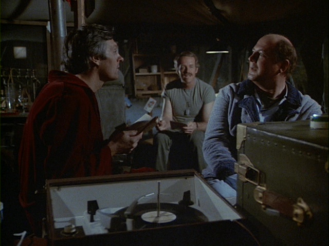 Still from the M*A*S*H episode Picture This showing Charles listening to music.